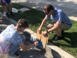 These Lemoore High School wrestlers found time to paint or improve house numbers in an effort to assist local law enforcement identify addresses.